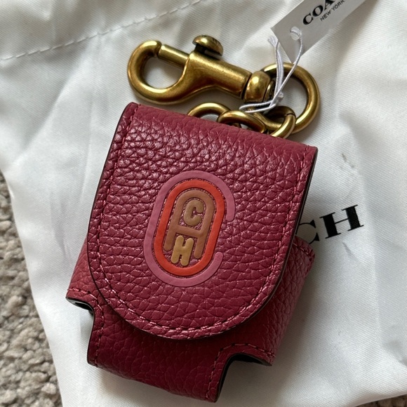 Coach Accessories - Coach Burgundy Leather air pod case  with Gold Hardware  magnetic closure NWT